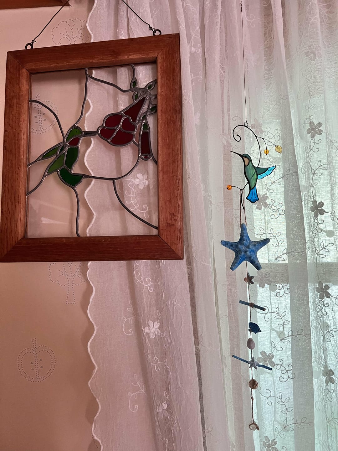 Customer photo review of Hummingbird Taking Off from a Branch suncatcher