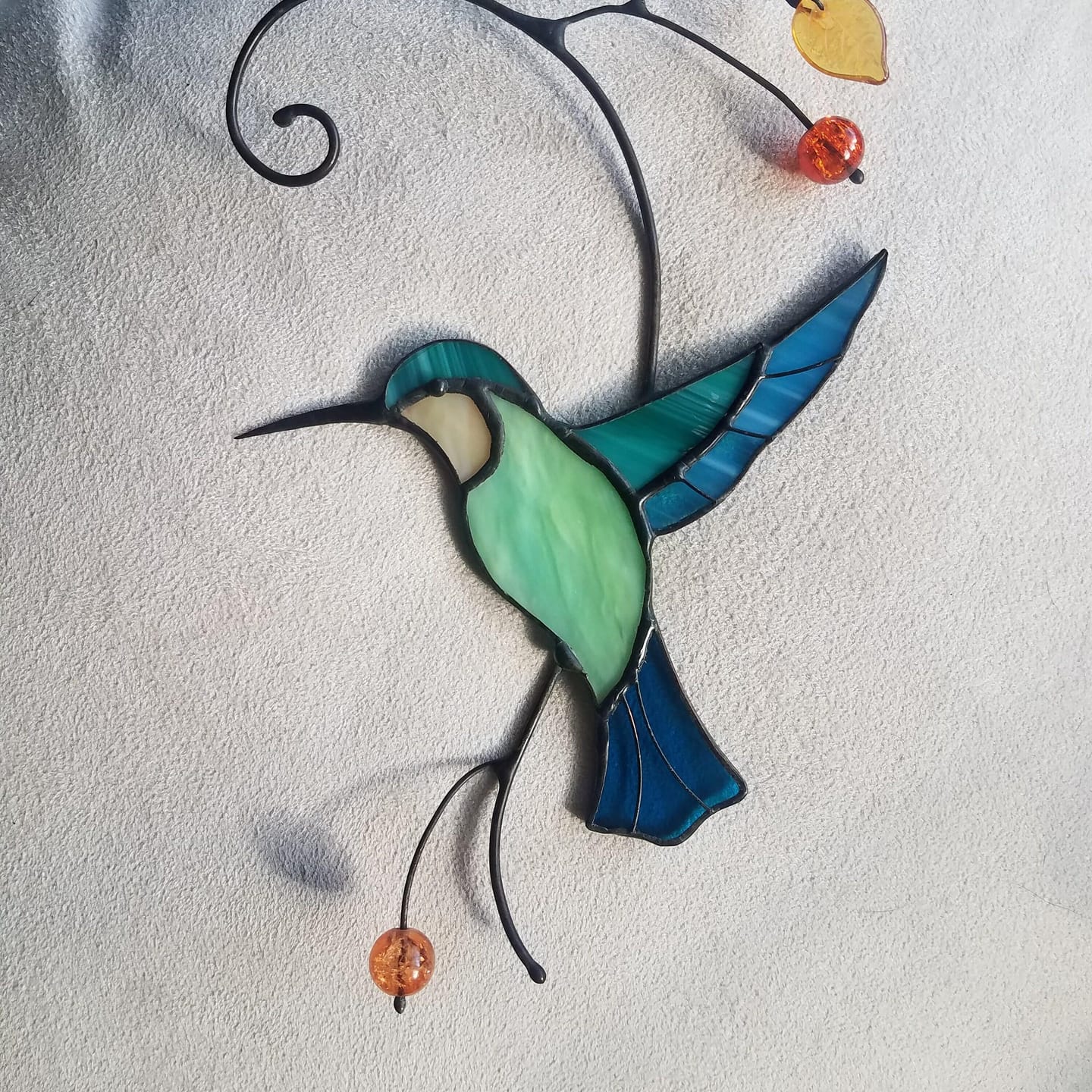 Customer photo review of Hummingbird Taking Off from a Branch suncatcher