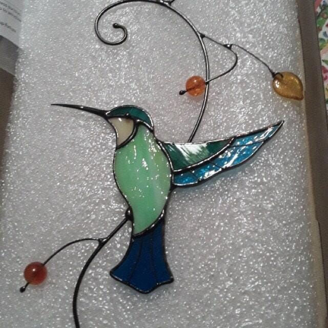 Customer photo review of Hummingbird Taking Off from a Branch suncatcher