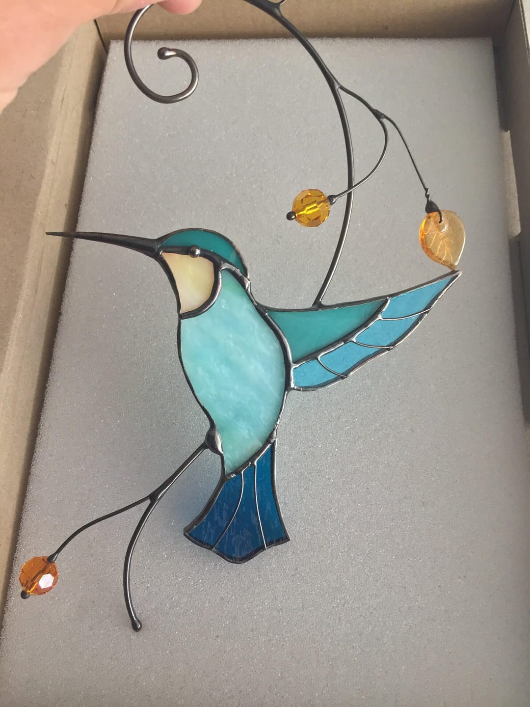 Customer photo review of Hummingbird Taking Off from a Branch suncatcher