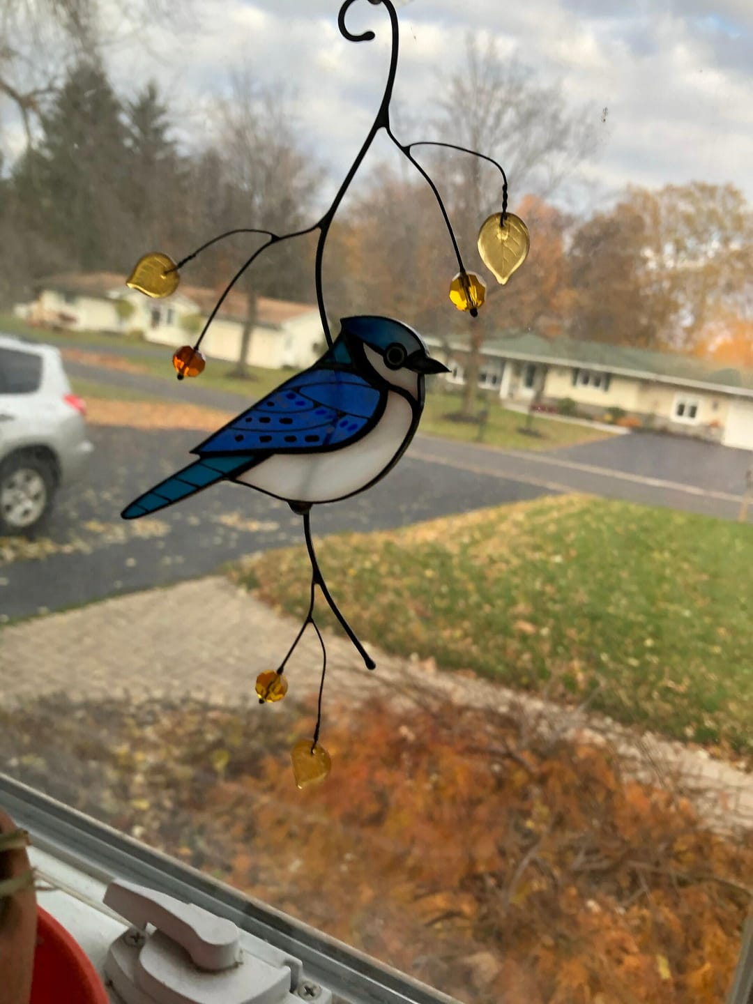 Customer photo review of Blue Jay stained glass bird realistic on a branch