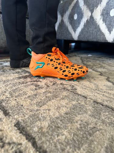 Customer photo review of The Flintstones "Bedrock Blitz" Football Cleats - Quantum Speed by Phenom Elite
