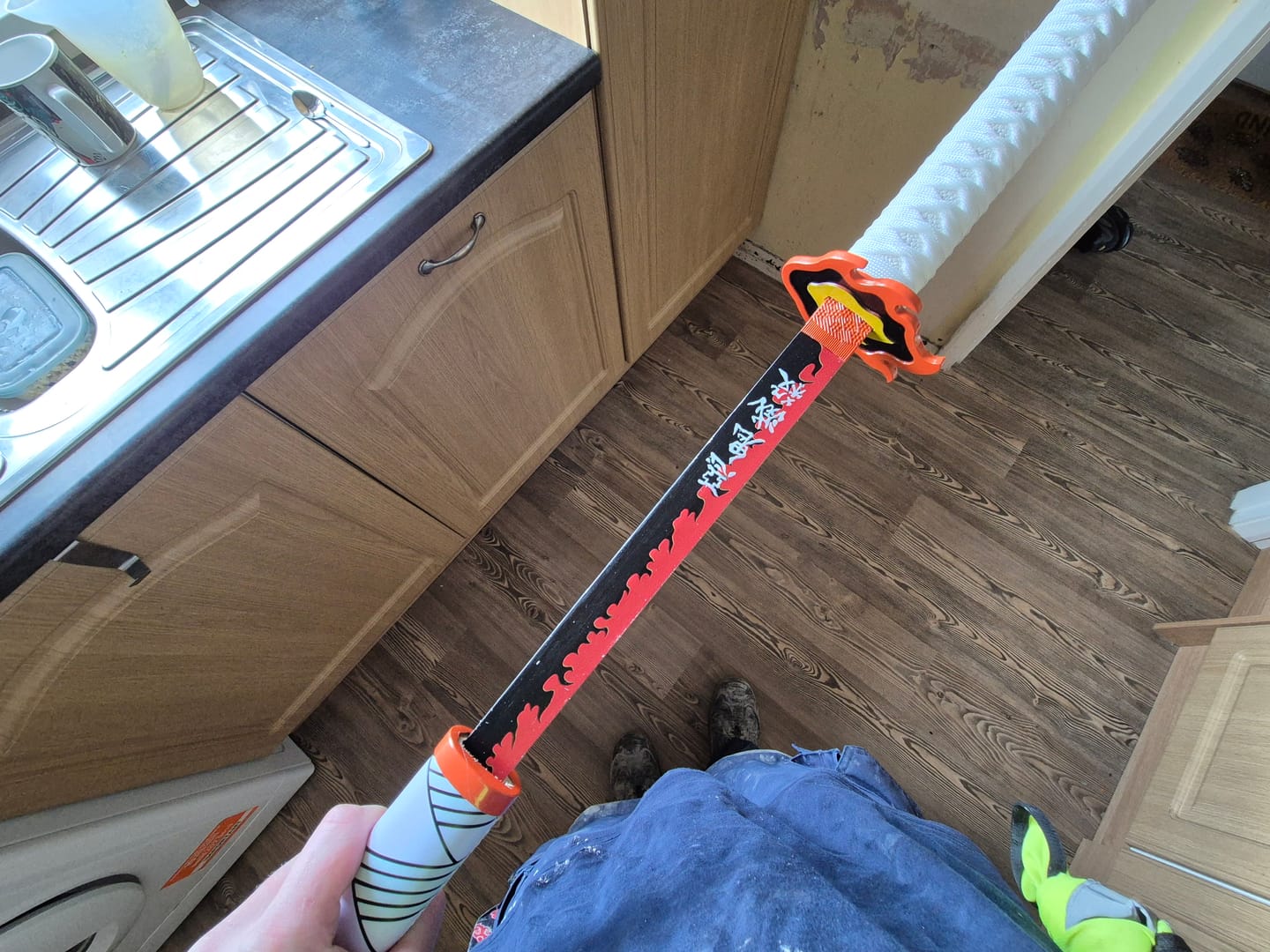 Customer photo review of Demon Slayer - Kyojuro Rengoku Red Nichirin Display (Straight Blade) Katana