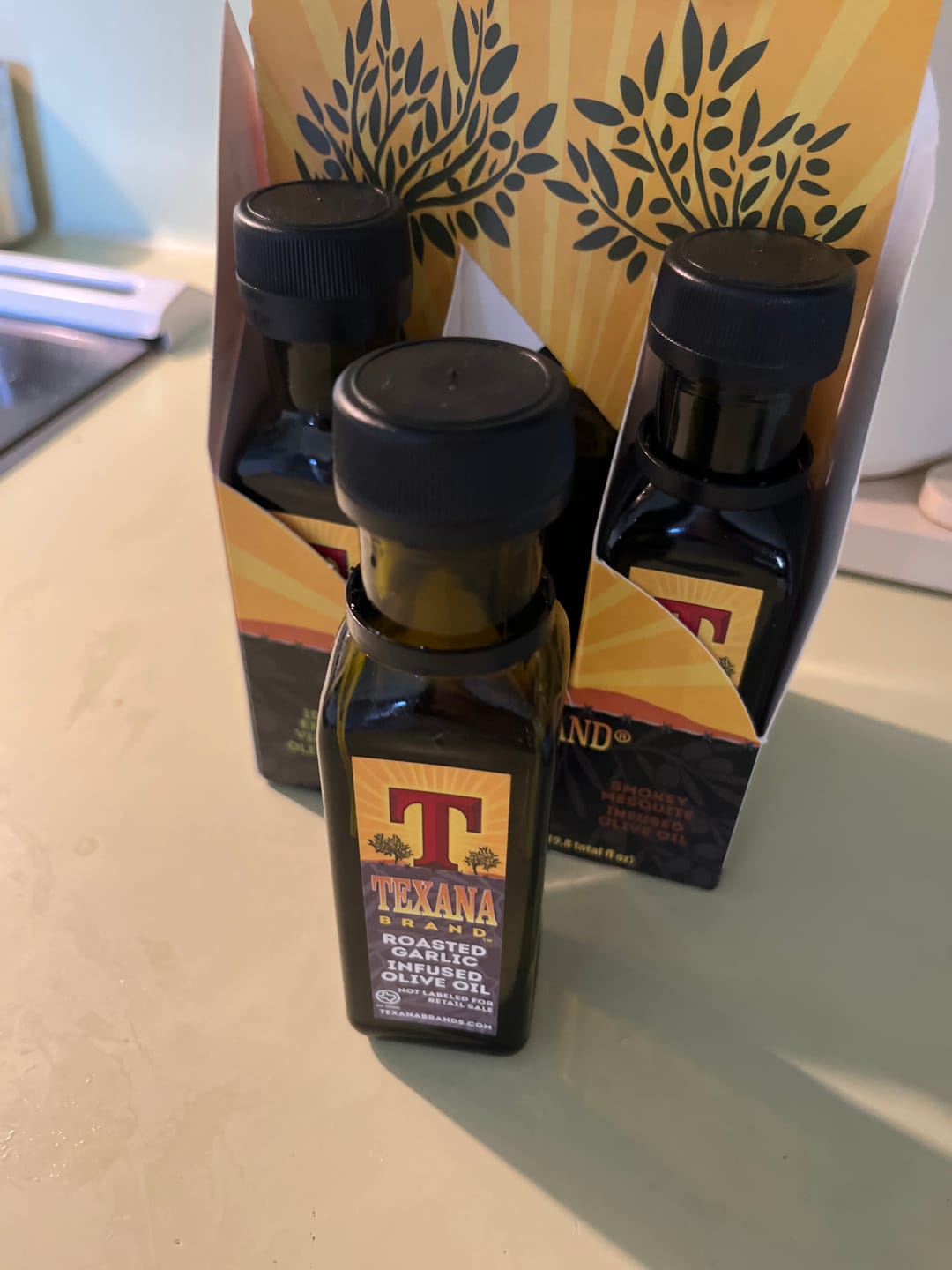 Customer photo review of Texana Brand EVOO, Garlic, Mesquite, Cajun, Lemon, and Herb  Six-Pack Sampler (3.3fl oz Bottles)
