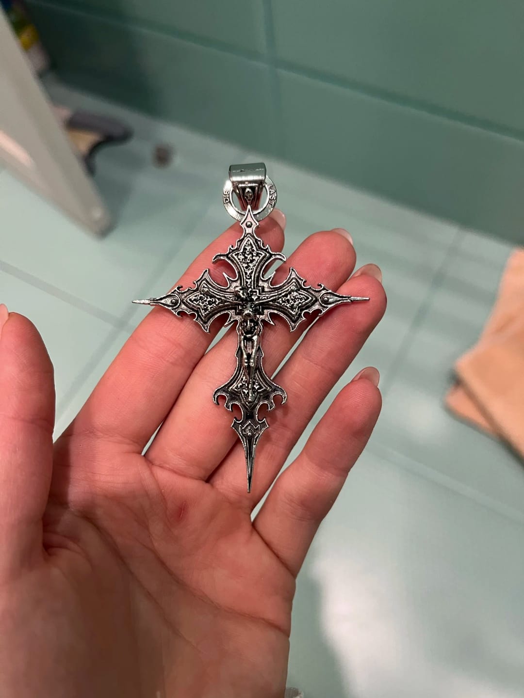 Customer photo review of Spire Cross Necklace