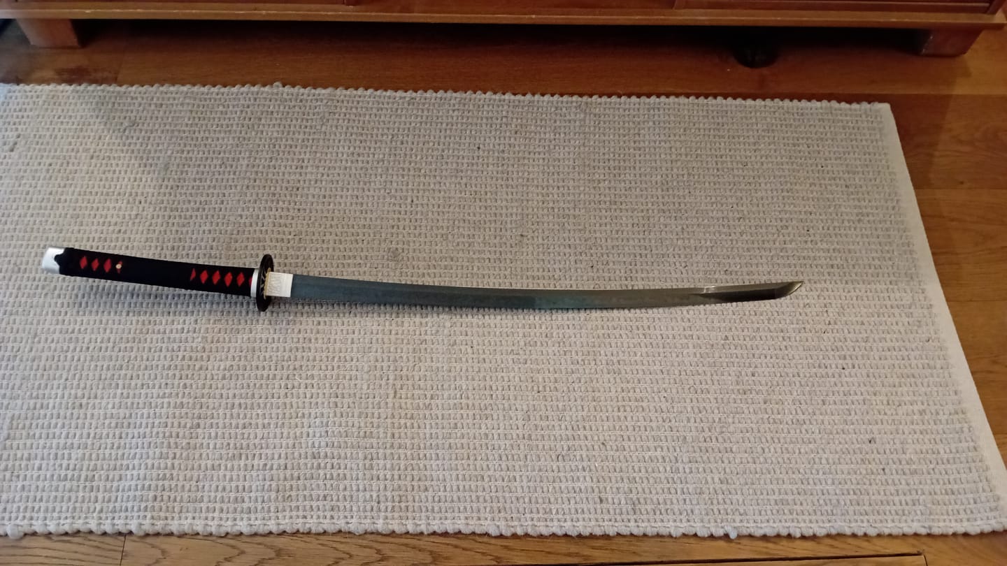 Customer photo review of The Tanjiro Handmade Katana T10 Steel Clay Tempered From Demon Slayer