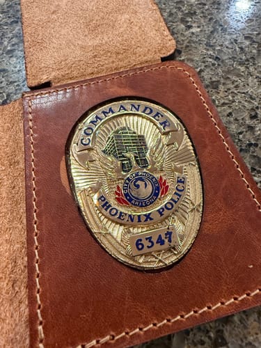 Matt S.'s wallet with badge
