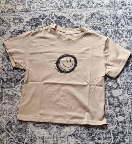 Customer photo review of Neutral Smiley Face T-Shirt