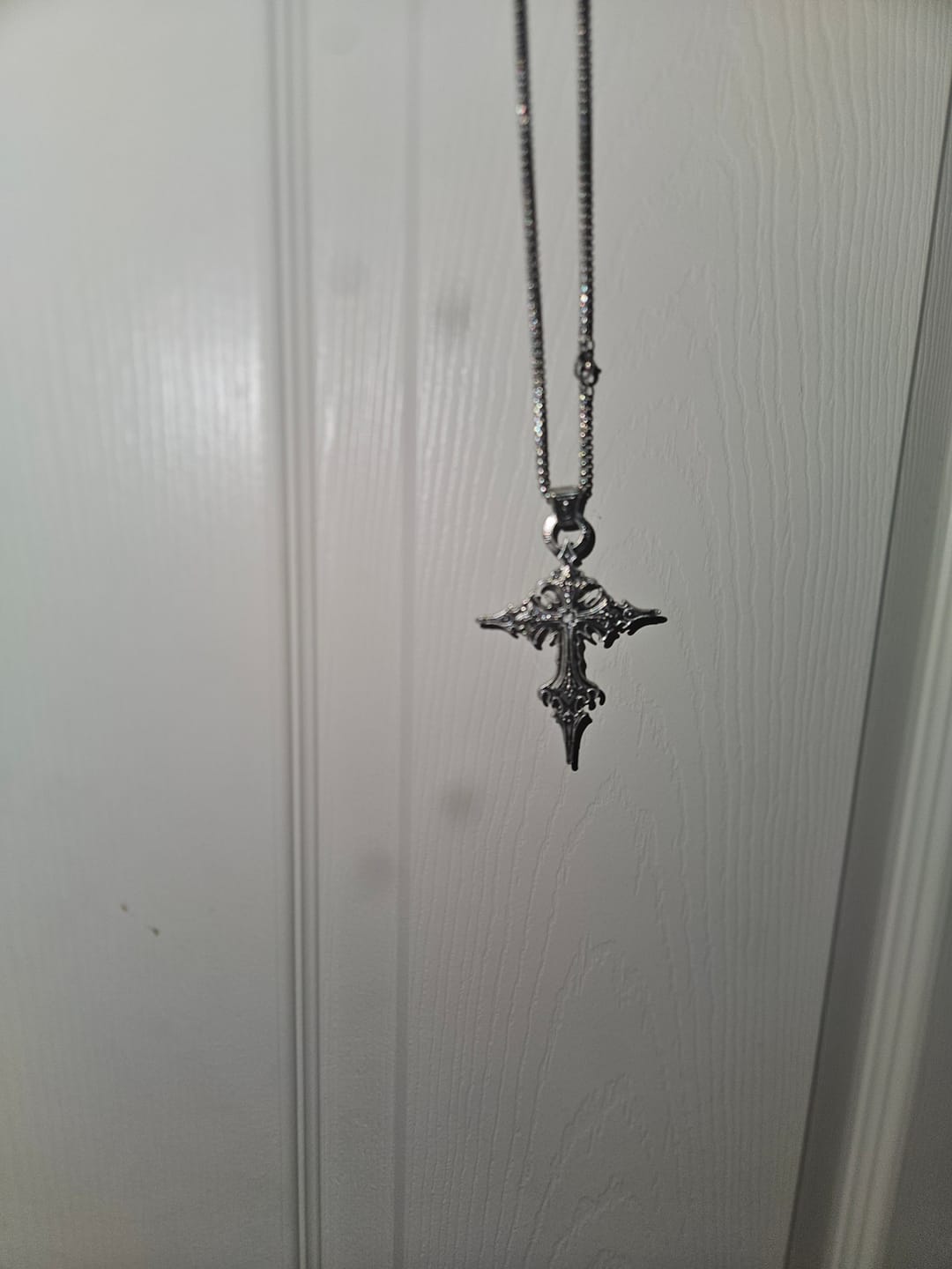 Customer photo review of Spire Cross Necklace