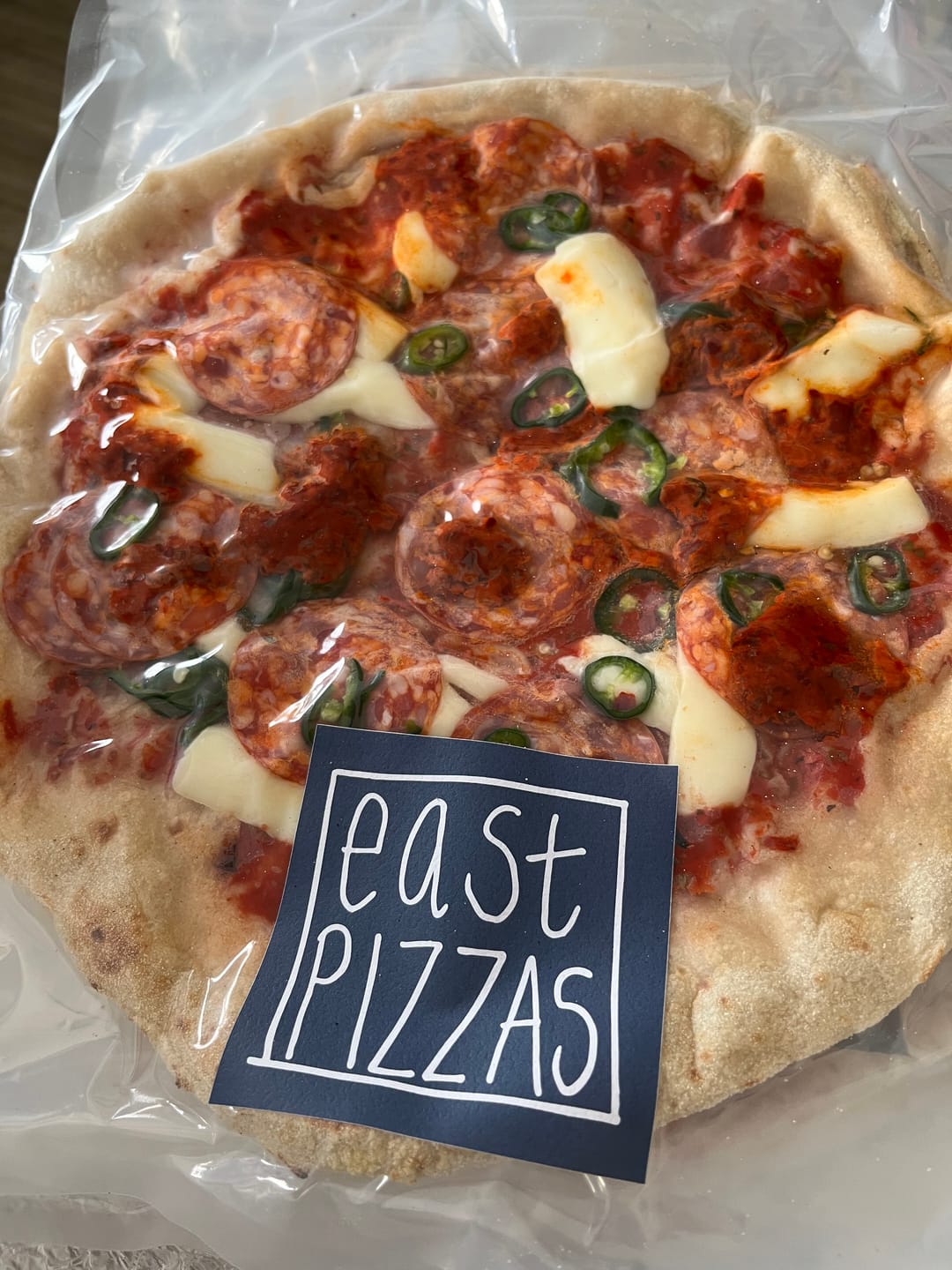 Customer photo review of Topped Spicy Pizza