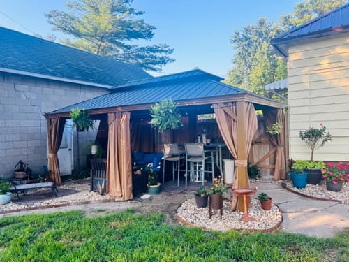 Customer photo review of Homrest 12X20 ultra thick columns and beams hardtop gazebo metal gazebo with faux wood grain aluminum frame dual material double roof outdoor patio gazebo pergolas with netting and curtains