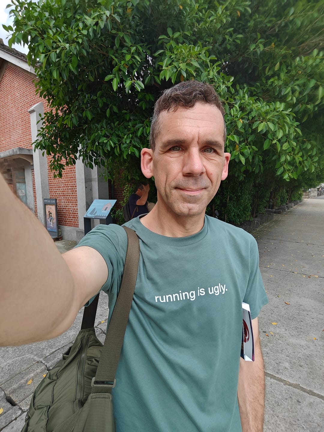Customer photo review of tee, running is ugly, green day.