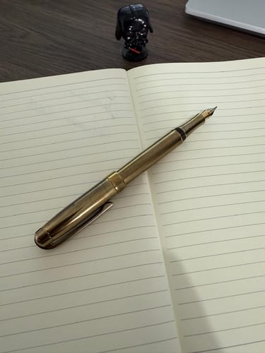 Customer photo review of Pluma Laban metálica color bronce vintage