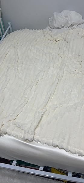Customer photo review of STRIPED RABBIT FAUX-FUR BLANKET - 50% OFF