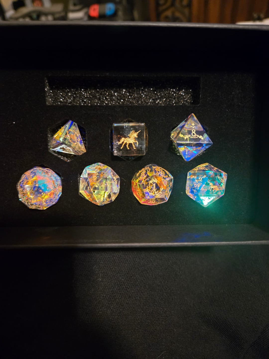 Customer photo review of URWizards D&D Dichroic Prism  Glass Engraved Dice Set Unicorn Style