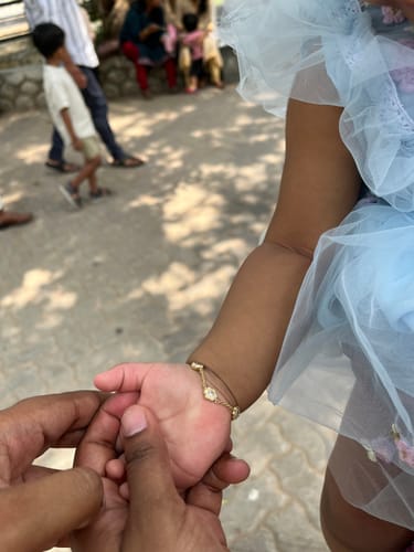 Customer photo review of Golden White Flower Kids Bracelet (0 - 2 years)