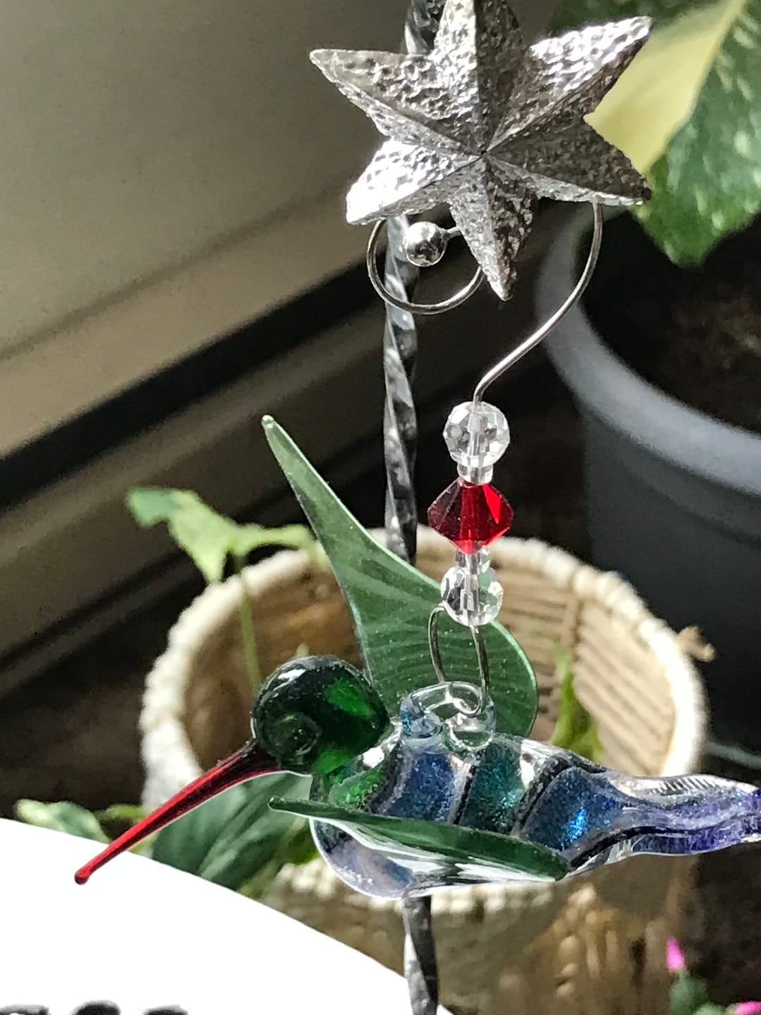 Customer photo review of Dichroic Twist Glass Hummingbird with Infused Ash