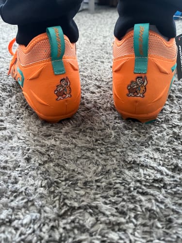 Customer photo review of The Flintstones "Bedrock Blitz" Football Cleats - Quantum Speed by Phenom Elite