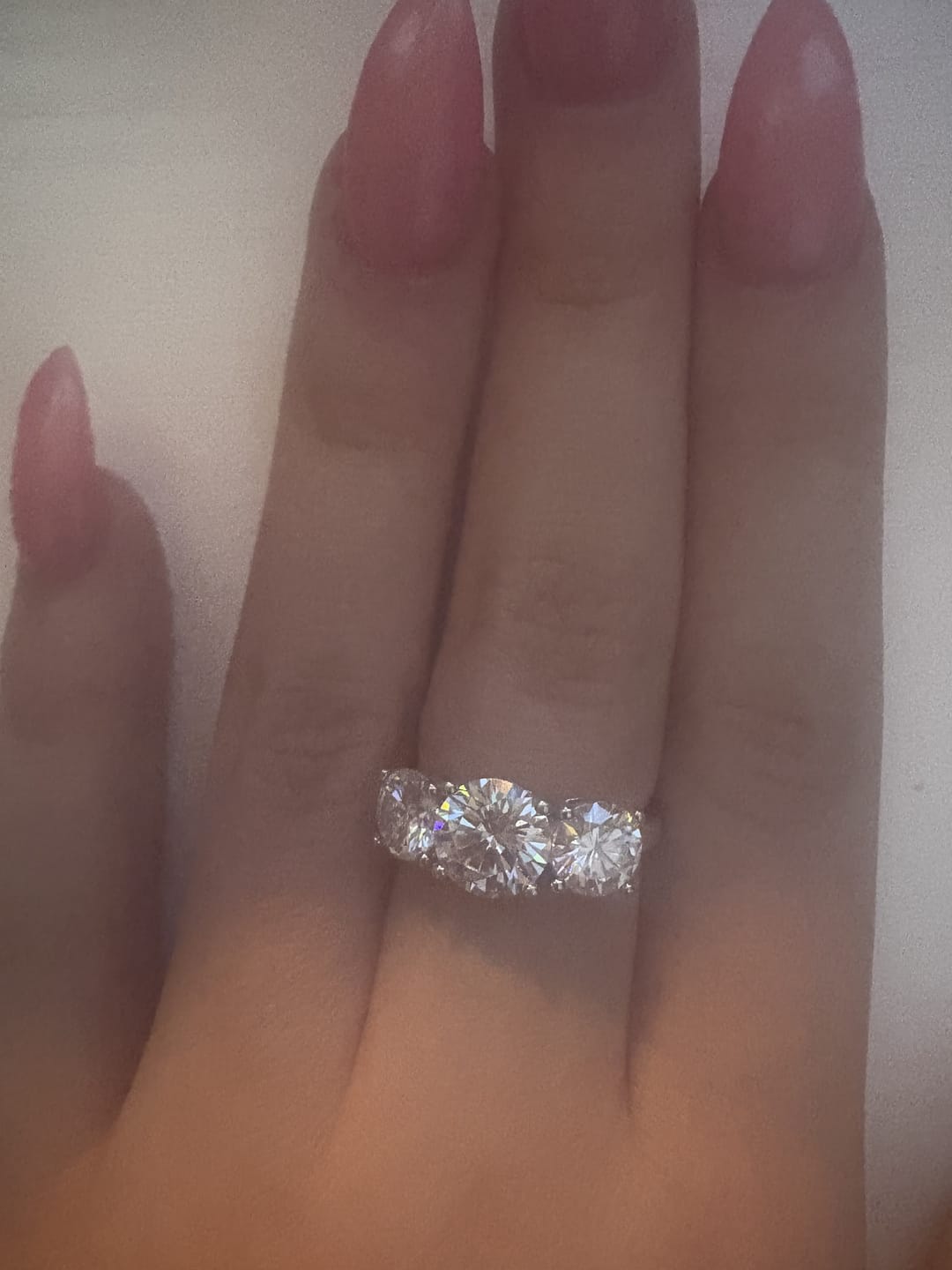 Customer photo review of Classic Three Stone Round Cut Moissanite Engagement Ring