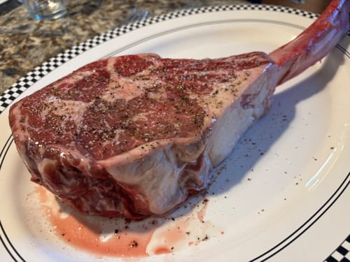 Customer photo review of Mini Bone Tomahawk Steak, Prime