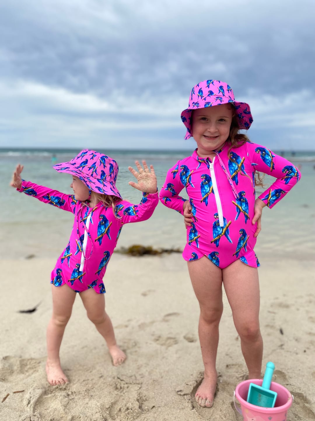 Customer photo review of Fluro Macaw Girls Long Sleeve Zip Swimmers