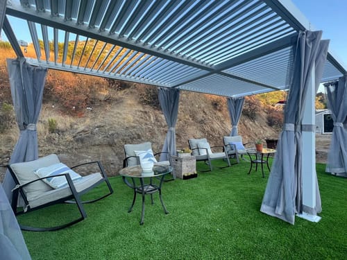 Customer photo review of HOMREST Louvered Pergola 10x20 Outdoor Hard Top Pergola with Aluminum Frame and Adjustable Metal Rainproof Roof for Garden & Patio, Curtains and Netting Included, White
