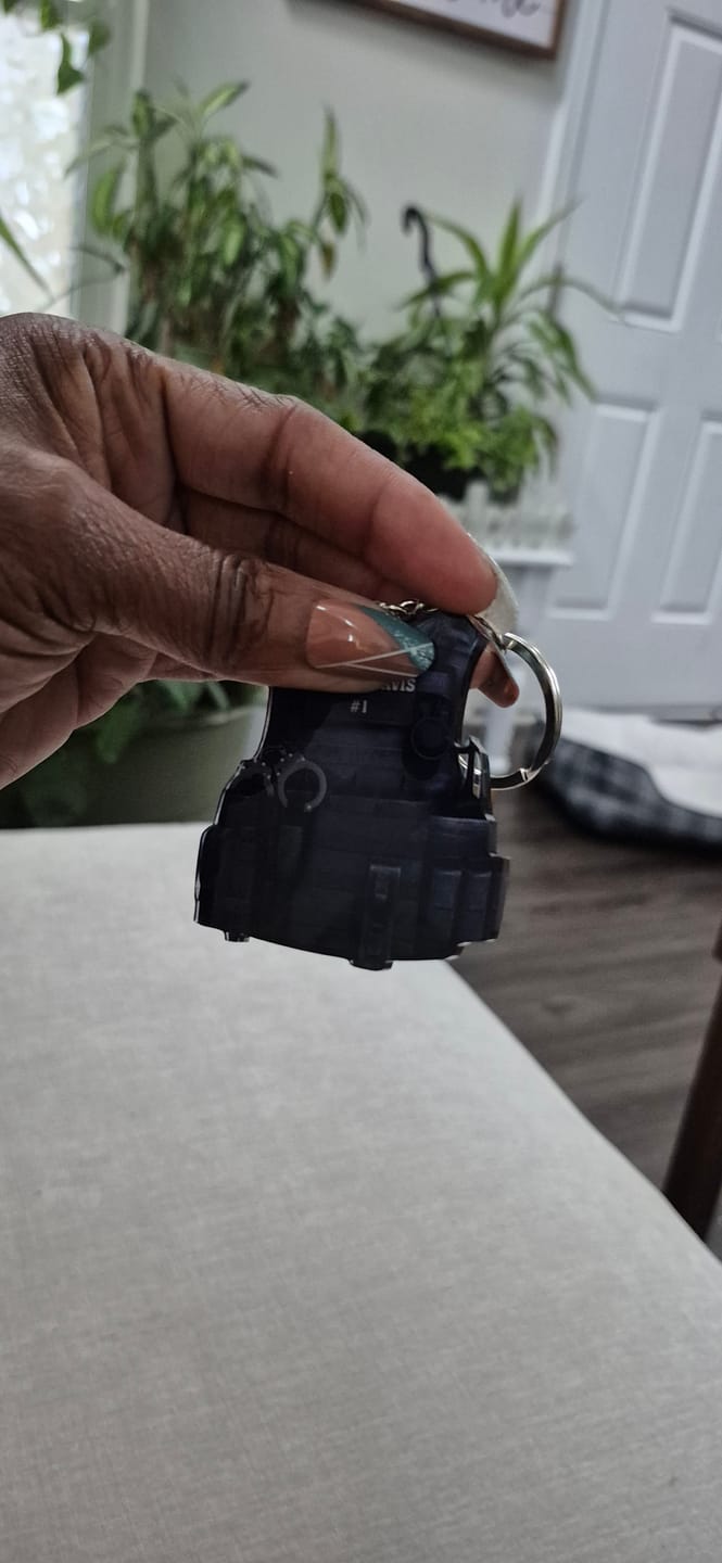Customer photo review of Personalized Law Enforcement Gift - Tactical Bulletproof Vest Keychain, Custom Name & Badge Number, Durable Acrylic Tribute for Police Retirement/Memorial Day