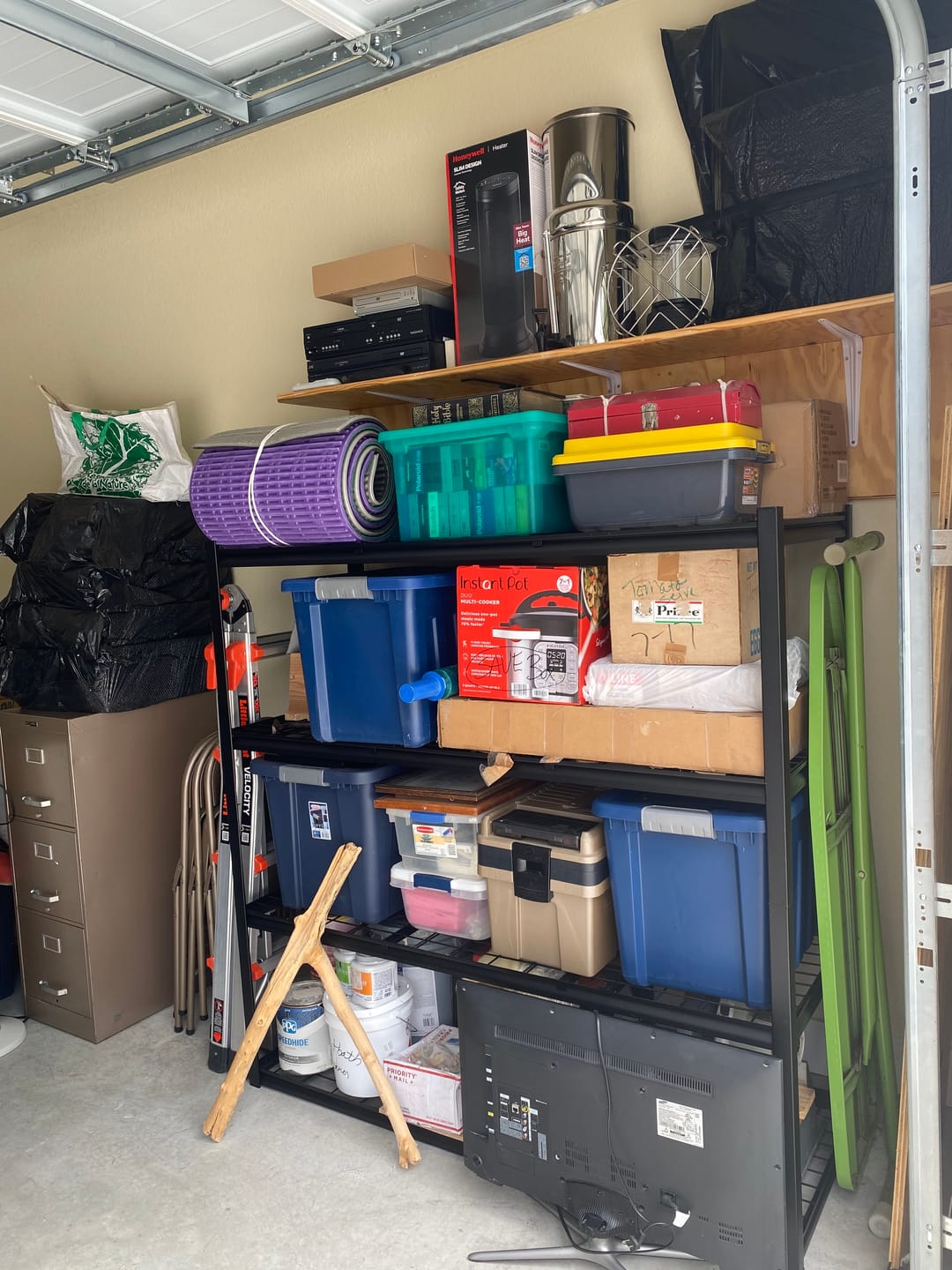 Customer photo review of REIBII 4-Shelf Storage Shelves 2550LBS Adjustable Heavy Duty Garage Shelving for Garage Basement