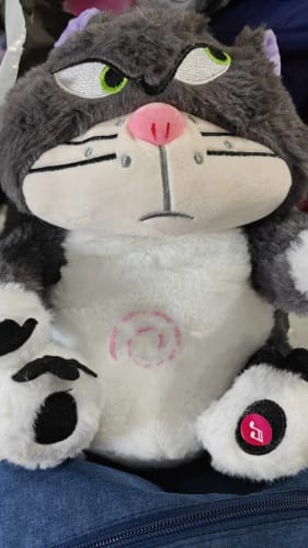 Customer photo review of Leering Cat Breathing Musical Plush Toy