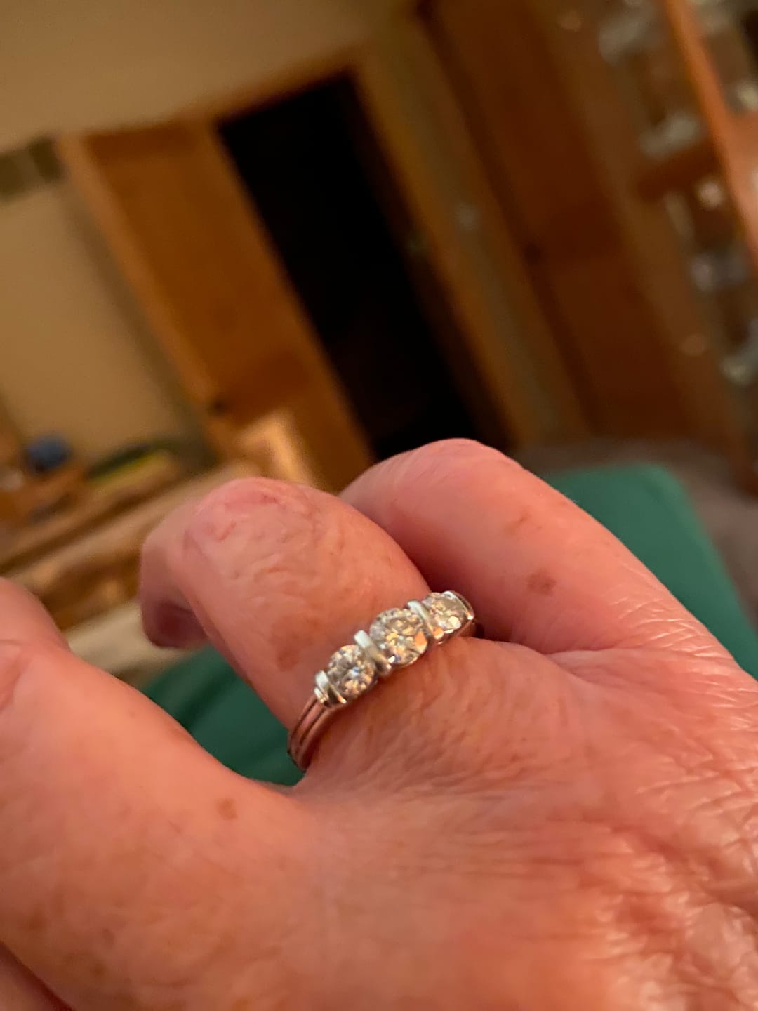 Customer photo review of Green Moissanite Side Stone Engagement Ring