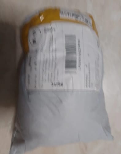 Customer photo review of Leering Cat Breathing Musical Plush Toy
