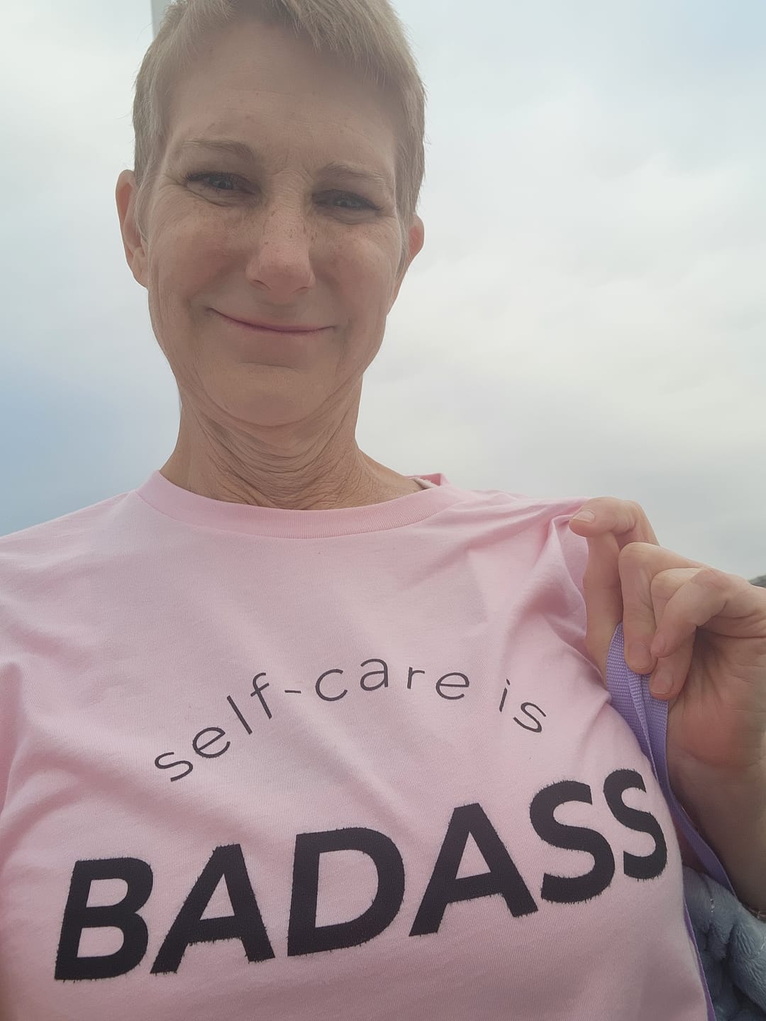 Customer photo review of Self-Care Is Badass T-Shirt