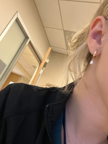 Customer photo review of Huggie Hoops + Tiny Pearl Drop Charm