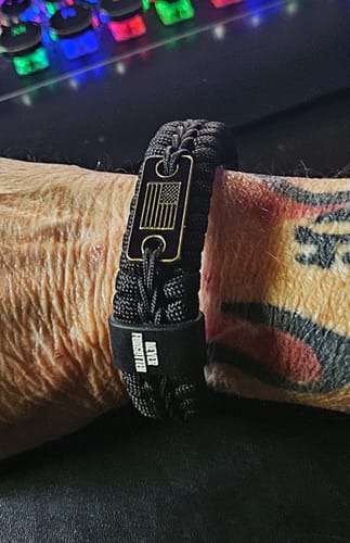 Customer photo review of Never Forgotten Black Paracord Bracelet: Helps Pair Veterans With A Service Dog Or Shelter Dog