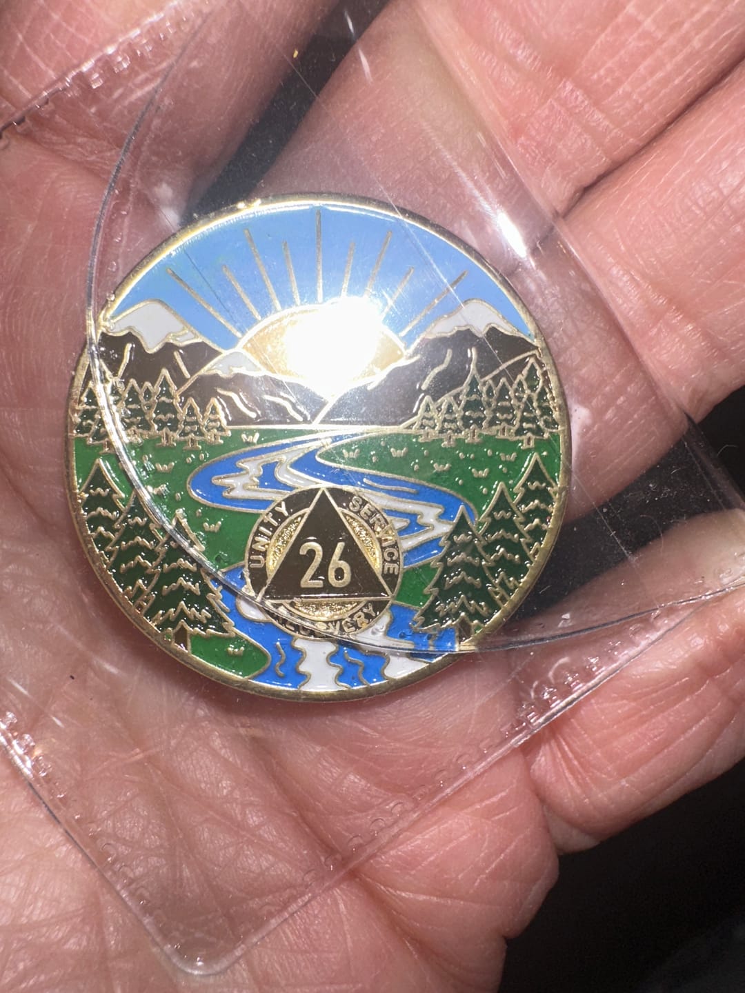 Customer photo review of 1 to 65 Year Sobriety Mint Winding River Gold Plated AA Recovery Medallion/Chip/Coin