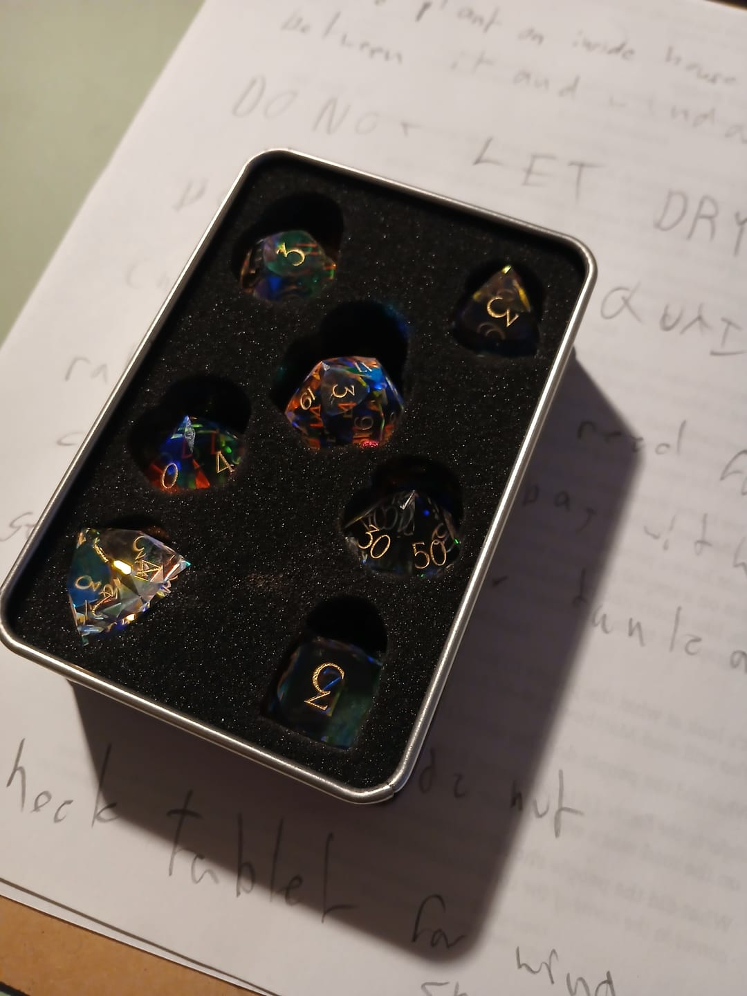 Customer photo review of URWizards D&D Multi-faceted Prism Glass Engraved Dice Set
