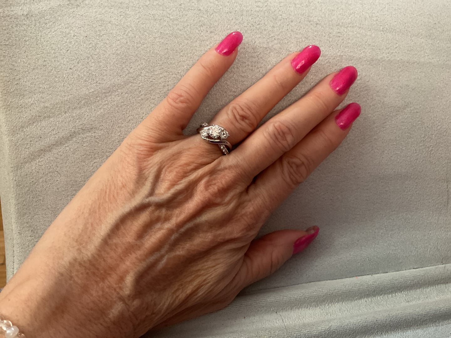 Customer photo review of Swirl Three Stone Moissanite Twisted Pave Engagement Ring