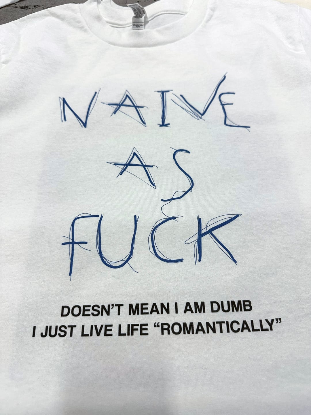 Customer photo review of Naive AF - Graphic Tee