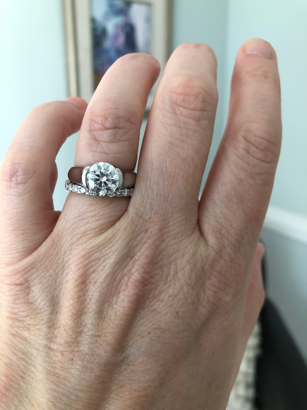 Customer photo review of Solitaire Moissanite Half Bezel Set Sterling Silver Engagement Ring