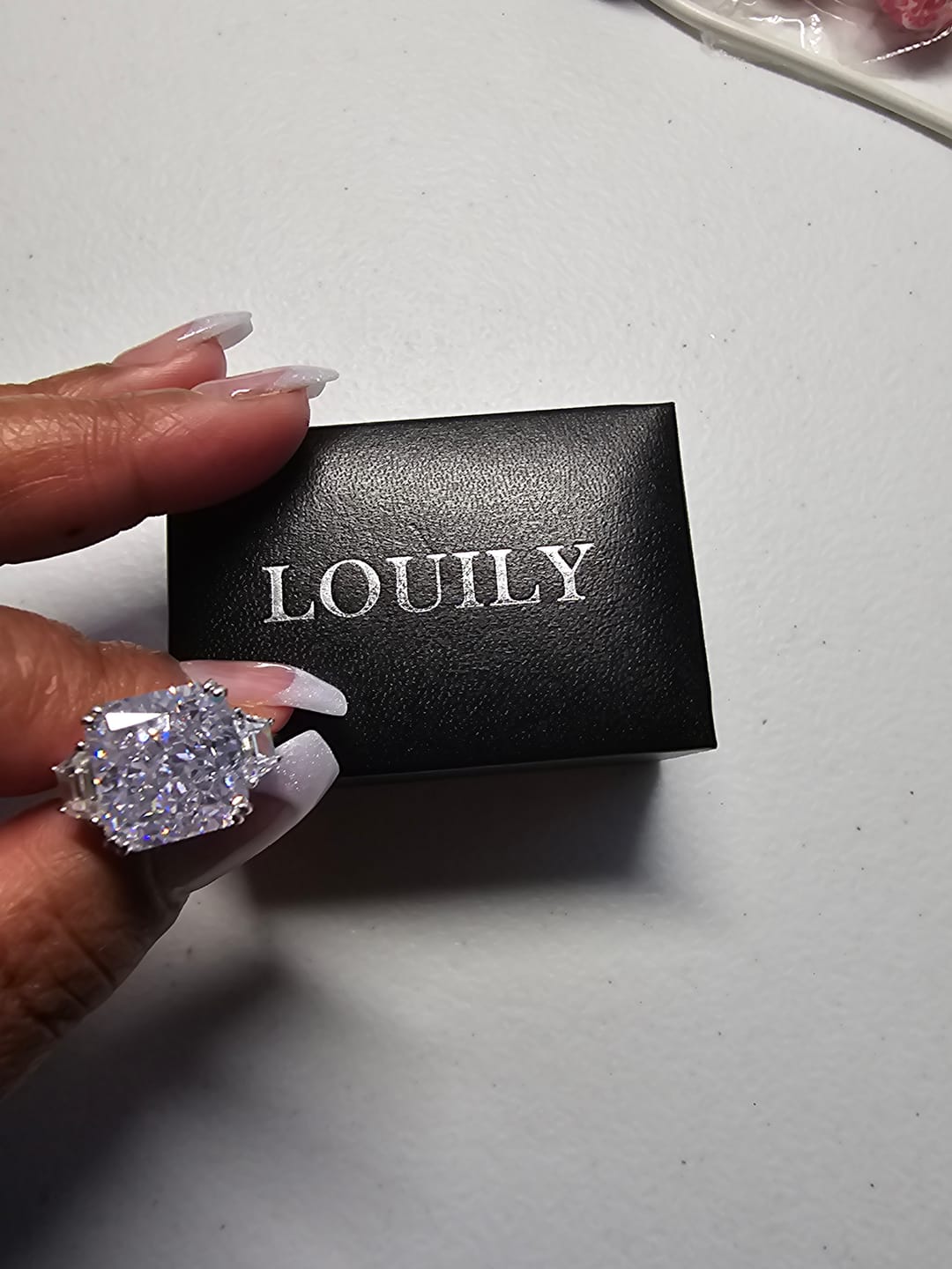 Customer photo review of S925 6.5/12.0 Ct Radiant Cut Crushed Ice Simulated Diamond Three-Stone Engagement Travel Ring