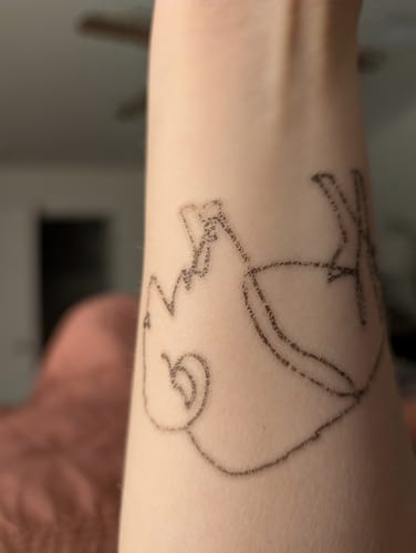 Customer photo review of Minimal Buffalo Tattoo