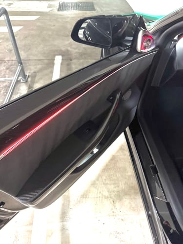 Customer photo review of Real Molded Gloss Carbon Fiber Door Armrest Panel Overlay Covers 4Pcs for Tesla Model 3 2023-2025 Highland