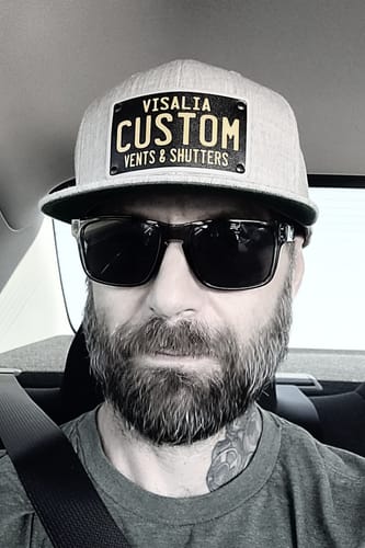 Customer photo review of Black & Yellow Universal License Plate Hat