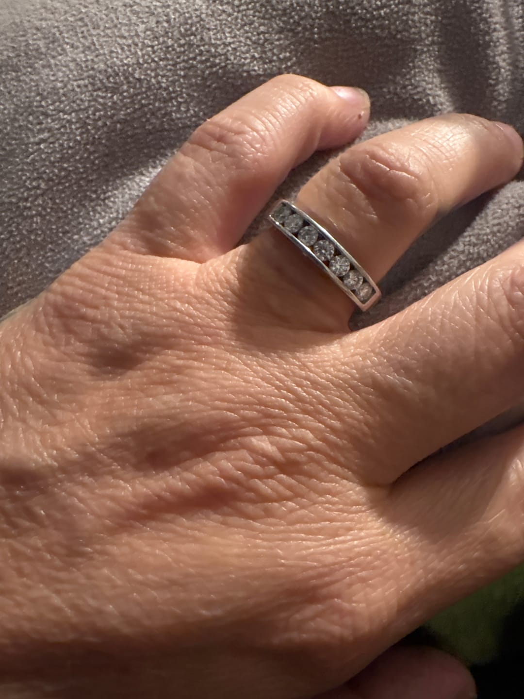 Customer photo review of Channel Set Moissanite Half Eternity Wedding Band Ring In Sterling Silver