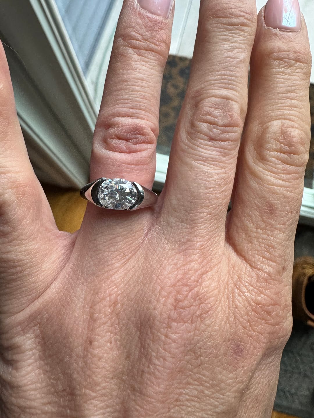 Customer photo review of Solitaire Oval Moissanite Half Bezel Set Engagement Ring