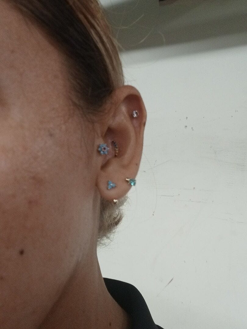 Customer photo review of 14K Gold Lovely Flower Labret Piercing 18G16G