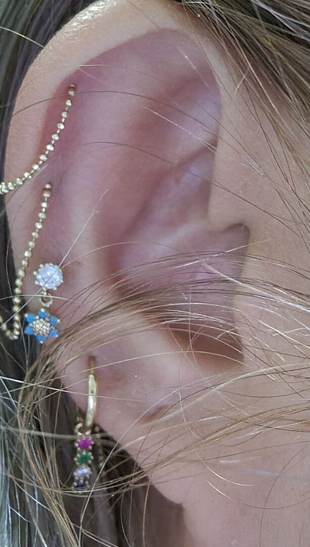 Customer photo review of 14K Gold Mini Flower Dangle Cartilage Earring 18G16G