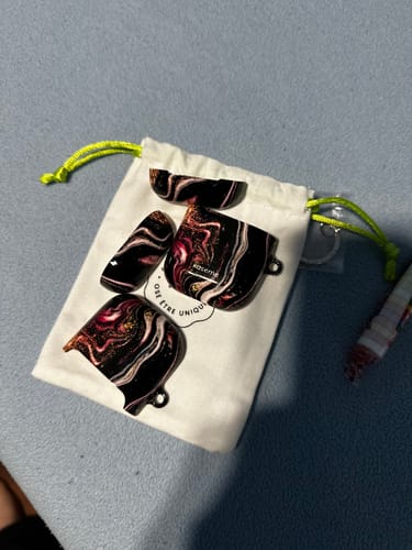 Customer photo review of Shimmering Secrets AirPods Case