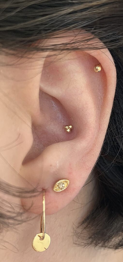 Customer photo review of 14K Gold Internally Threaded Triple Ball Tragus Labret Piercing 18G16G