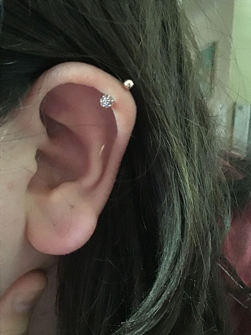 Customer photo review of 14K Gold Mini Flower Curve Piercing 20G